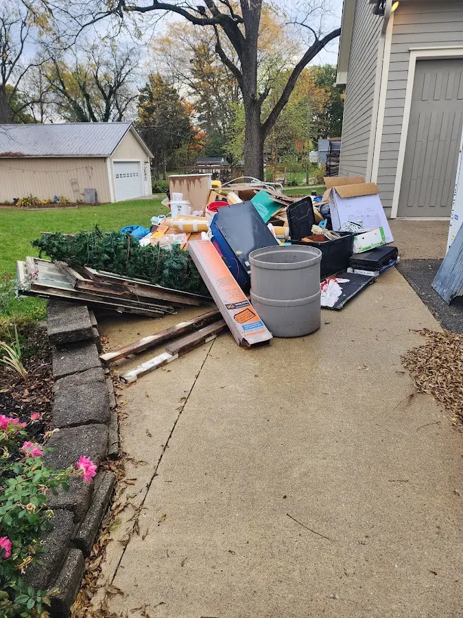 Dumpster being loaded with debris for 30 Yard Dumpster Rental in Norwell